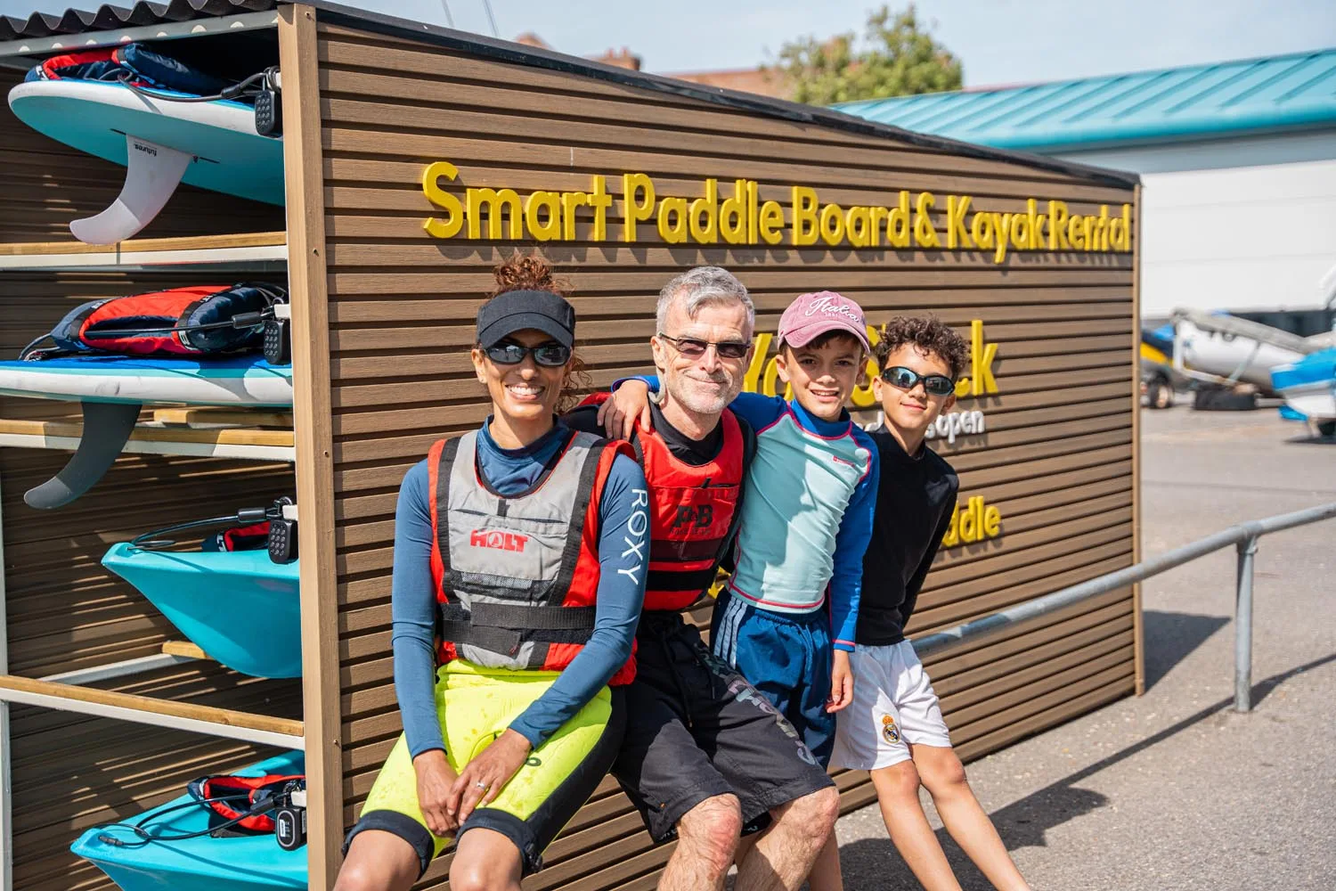 Family at the Yak Shack Smart Paddle Board & Kayak Rental station at Hamble Foreshore, Southampton