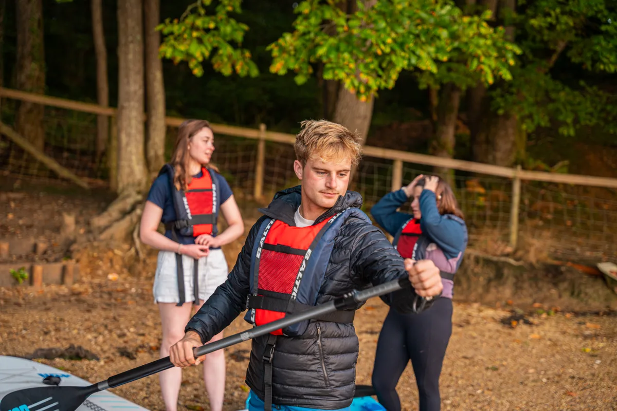 Paddlers with buoyancy aids ready to launch