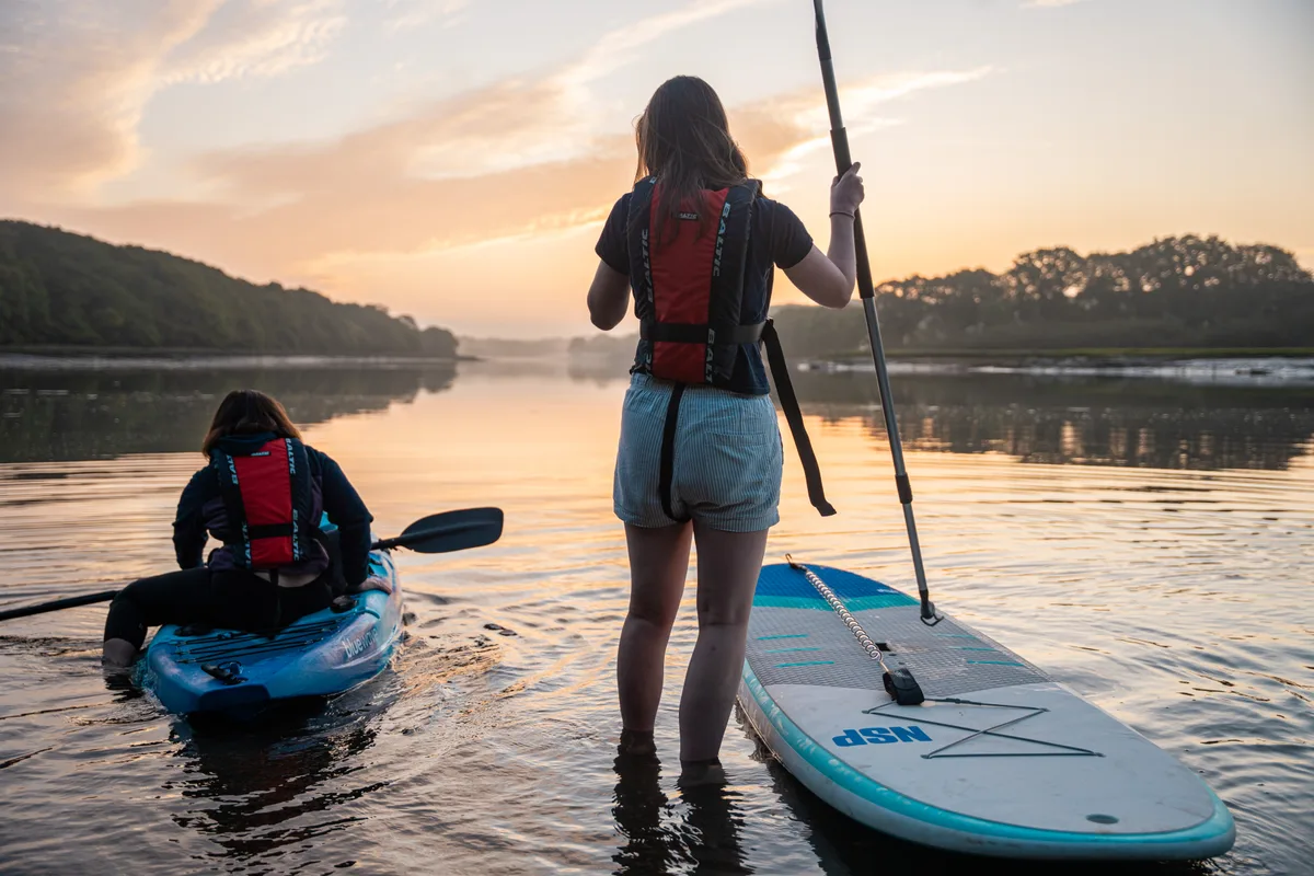 Paddleboarding and kayaking at sunset on the Hamble