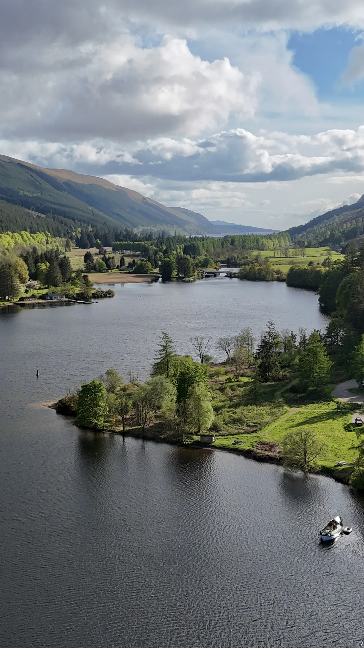 Aerial view of Loch Oich in the Great Glen, showing the wooded island, the pier and the surrounding Highland countryside