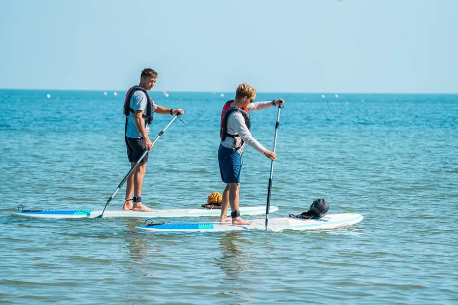 Two paddleboarders on the water at Shoreham-on-Sea